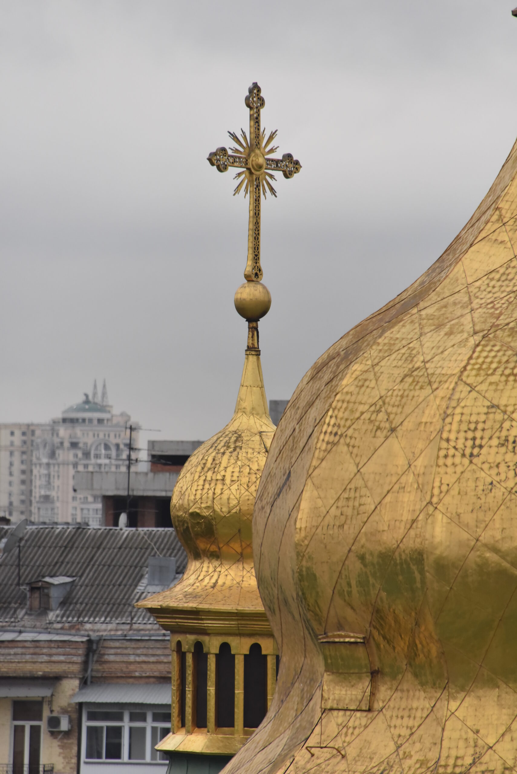 Golden domes of a Cathedral with cross.