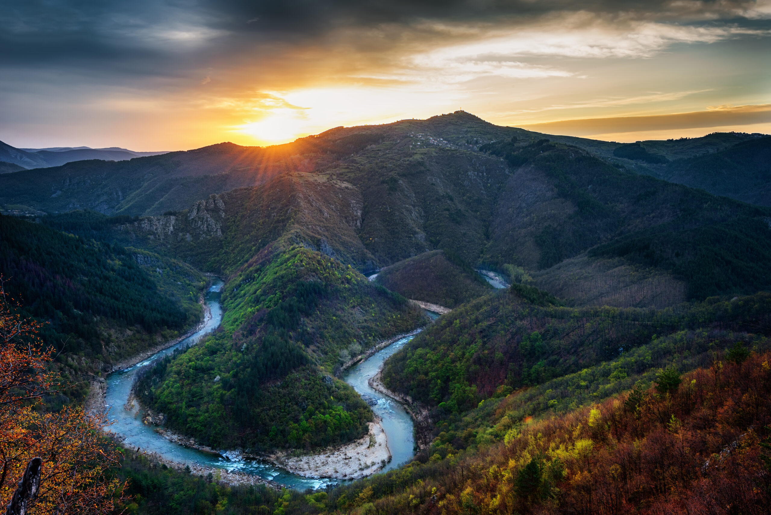 Spring sunrise above mountains along river in Bulgaria